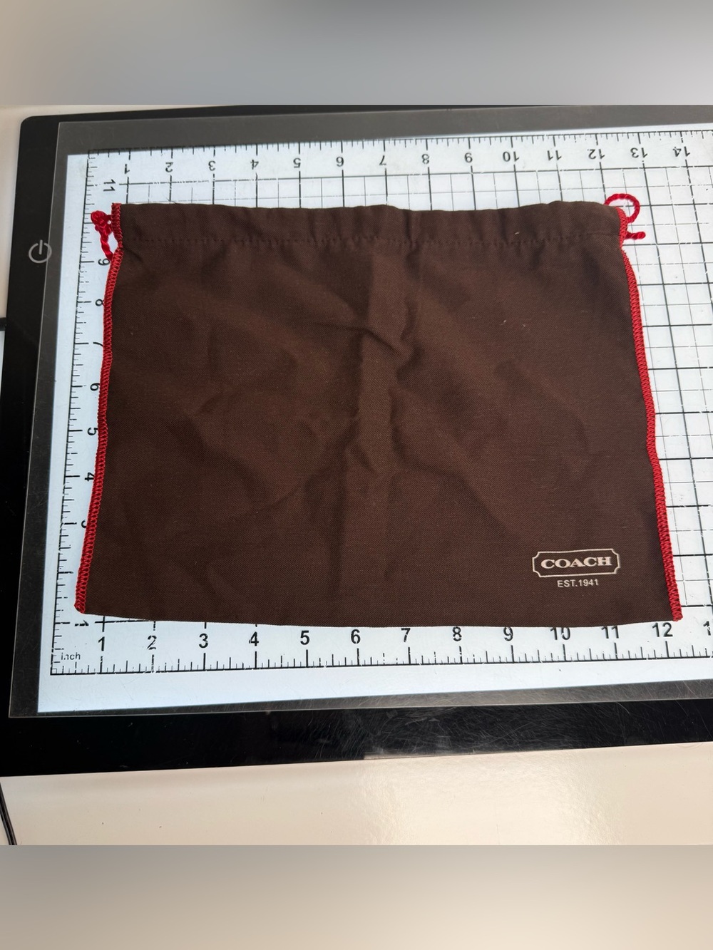 COACH Brown Drawstring Dust Bag with Red Trim. 12 by 9 inches